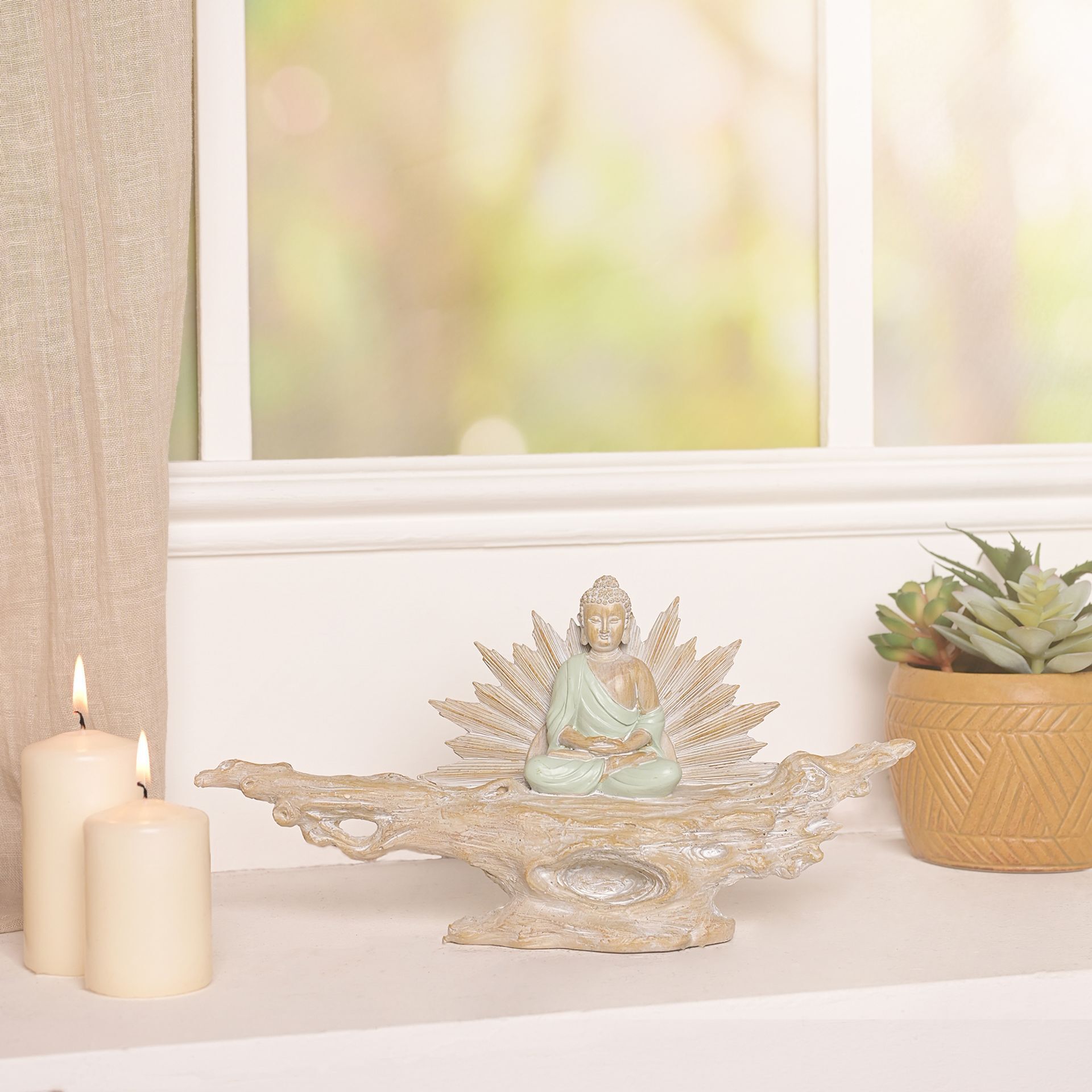 Juliana meditating buddha on a branch ornament