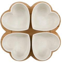 set of 5 ceramic taps heart shaped bowls on a wooden flower design board