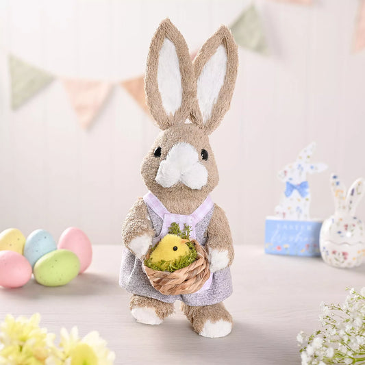 bunny holding a chick decoration for spring