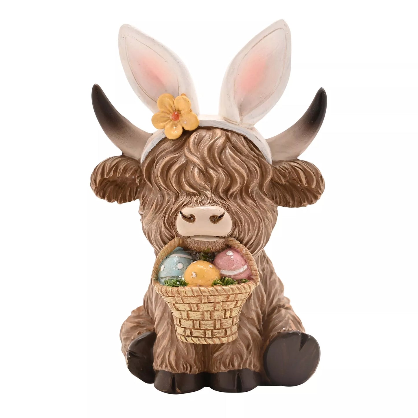 Highland cow easter figurine with bunny ears and Easter eggs basket in its mouth 