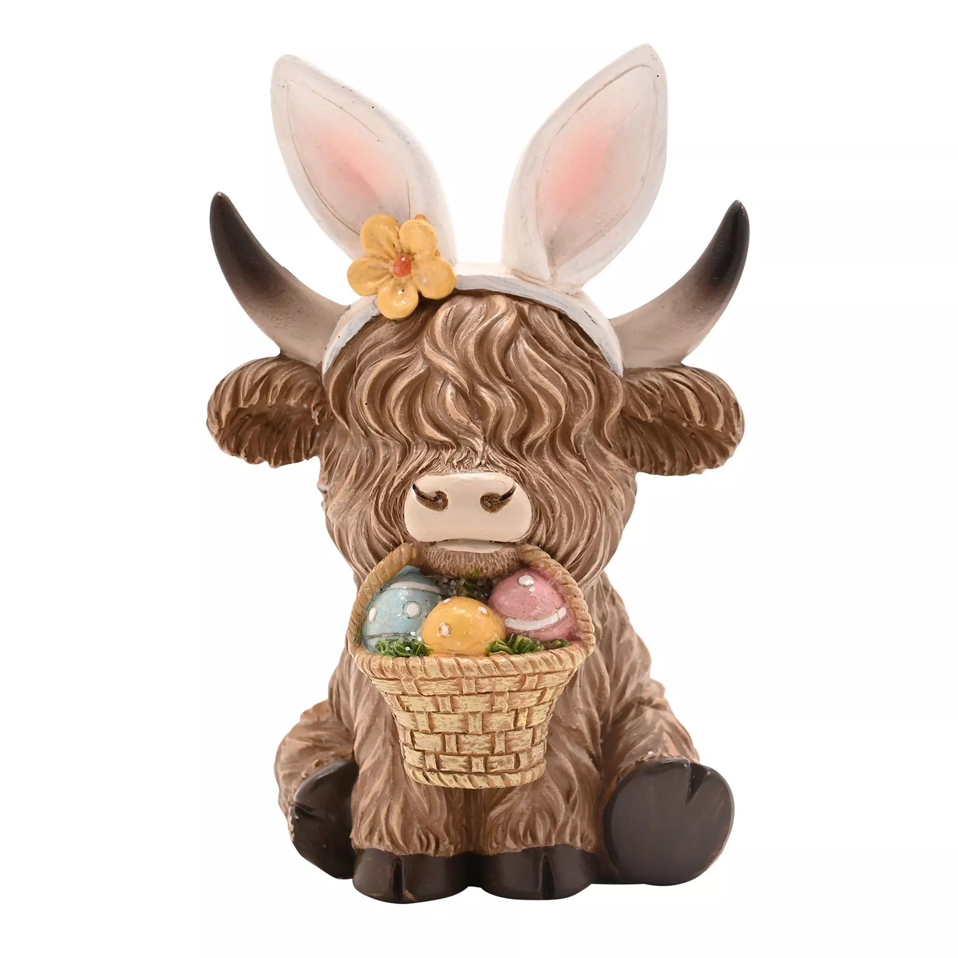 Highland cow easter figurine with bunny ears and Easter eggs basket in its mouth 