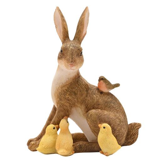 figurine of a rabbit with three yellow chicks and robin on its back