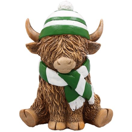 highland cow ornament wearing a green striped hat and scarf