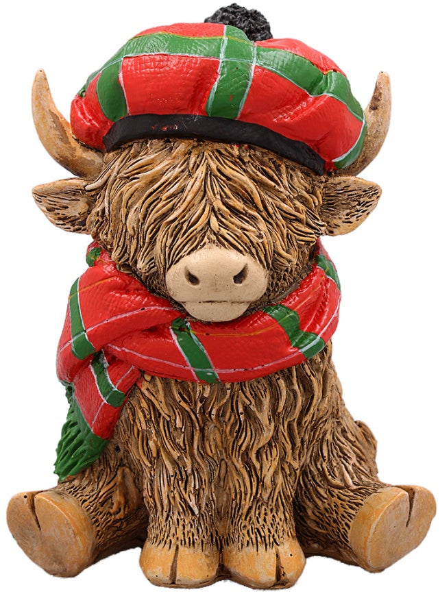 highland cow ornament wearing a tartan hat and scarf 