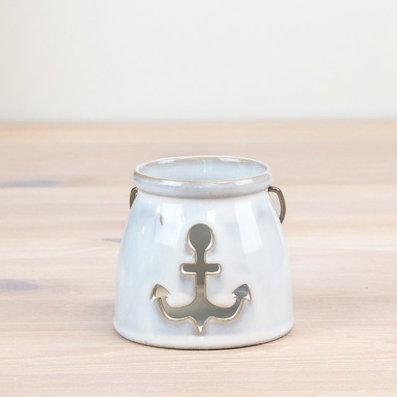 White ceramic candle holder with anchor design and metal handle