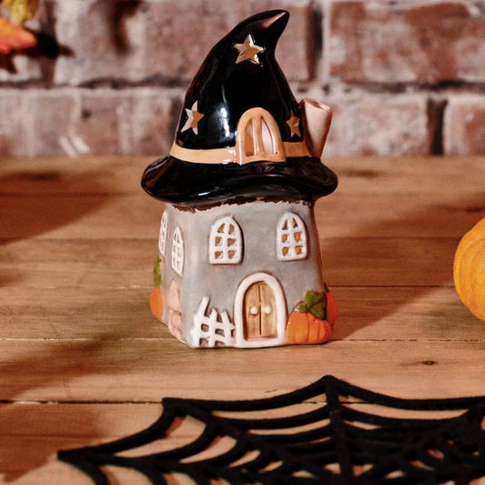 Haunted Hat Ceramic House Tea Light Holder for Halloween home décor with an illuminated spooky house design.