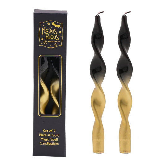 Set of 2 black and gold twisted candlesticks with packaging labeled 'Hocus Pocus'.