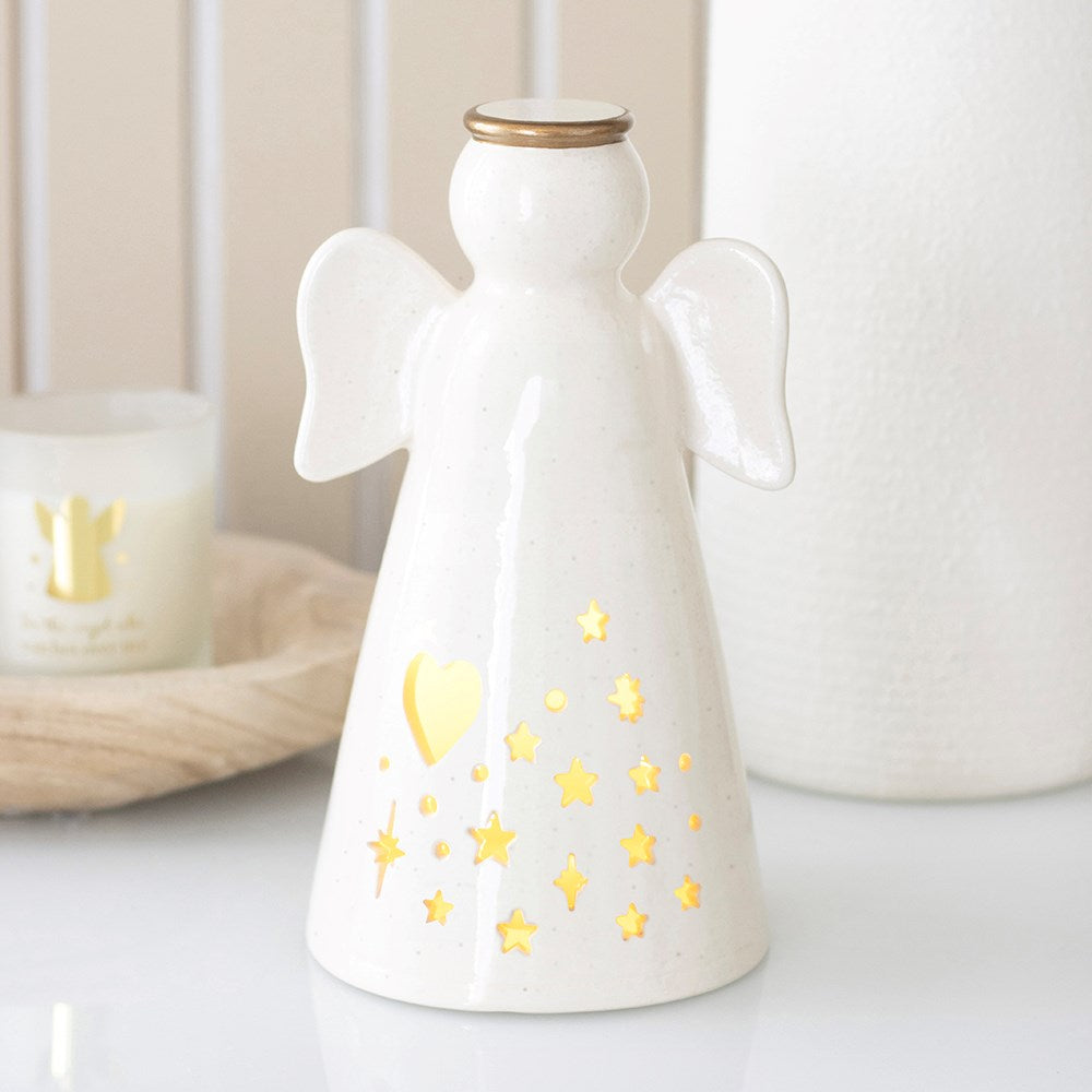 Small ceramic LED light up angel decoration with gold halo and glowing heart and star cut-outs