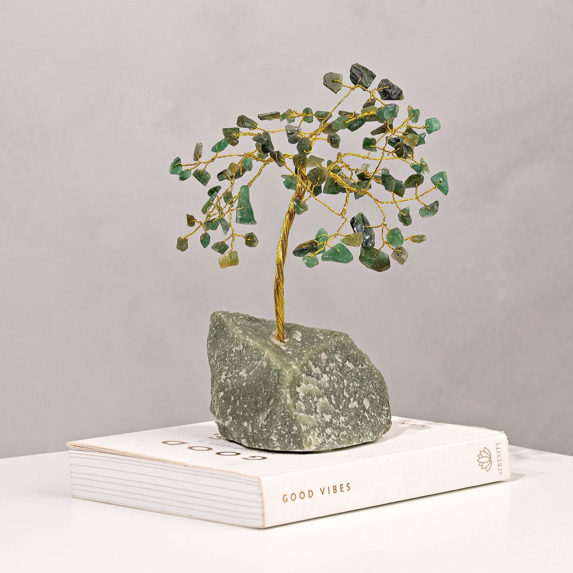 small green gemstone tree with crystal leaves and gold metal branches
