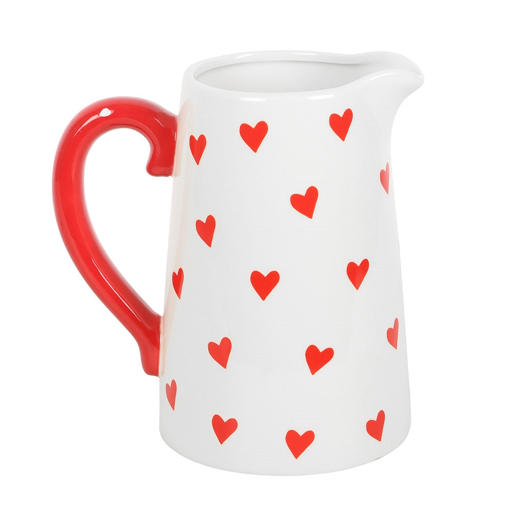 White jug with red love hearts printed all over it and red handle jug vase