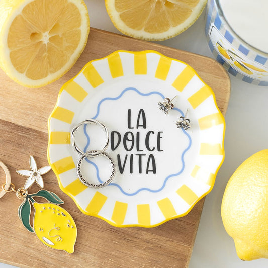 Decorative trinket plate with 'La Dolce Vita' text, yellow stripes 