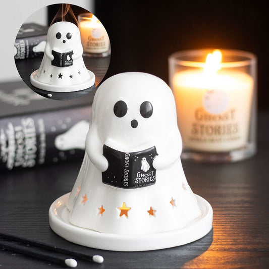 Ghost-shaped candle holder with a book titled 'Ghost Stories'