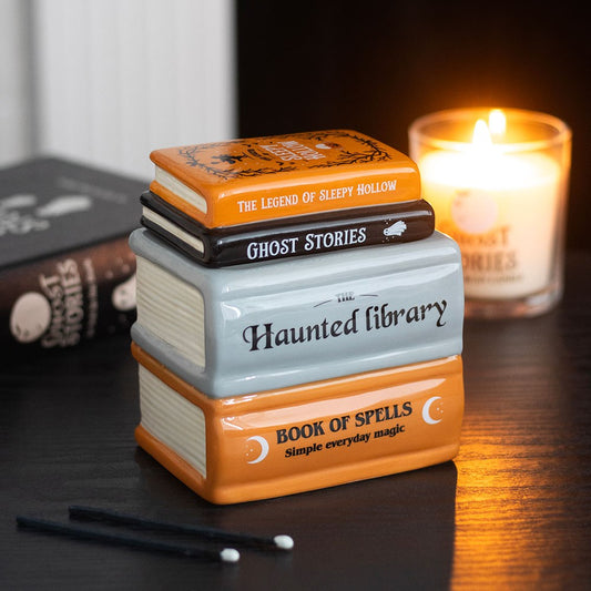 Stack of book-shaped ceramic wax warmer and oil burner haunted decorative