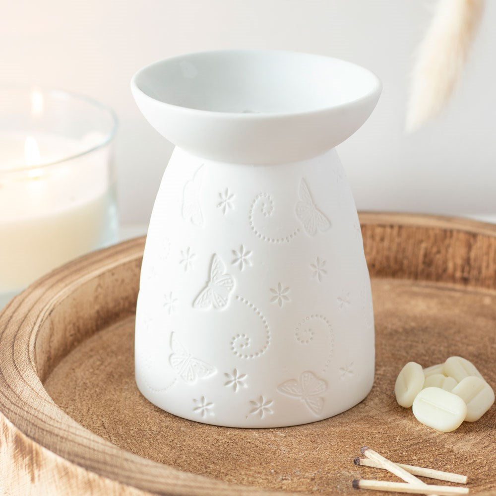 white ceramic butterfly oil burner