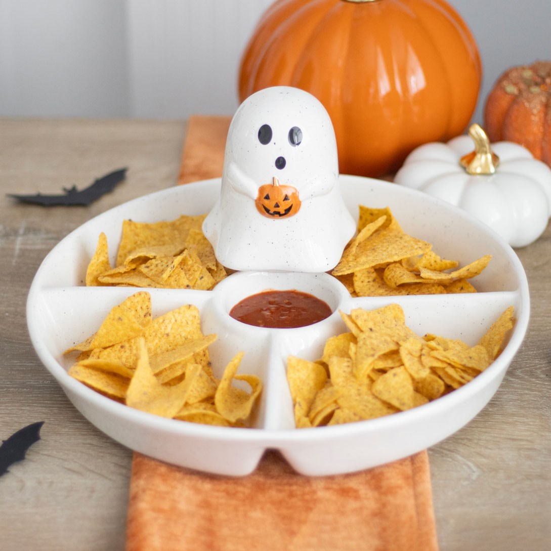 Ghost holding a small pumpkin chip and dip dish 