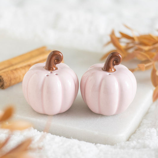 Pink pumpkin-shaped salt and pepper shakers with curly stems