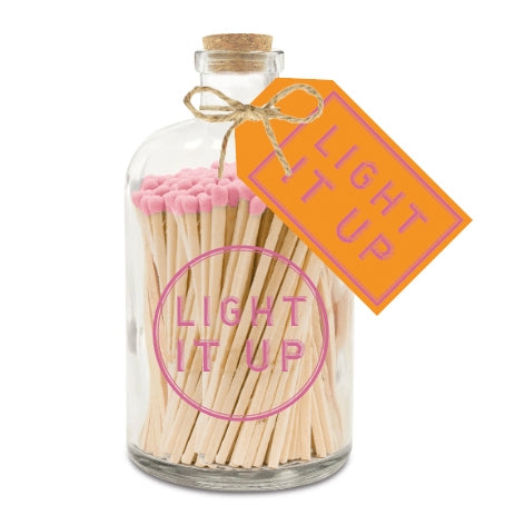 Matches With a Pink Top In a Glass Jar With "Light It Up" Text On Front And Tag Around The Neck. With a Cork Stopper