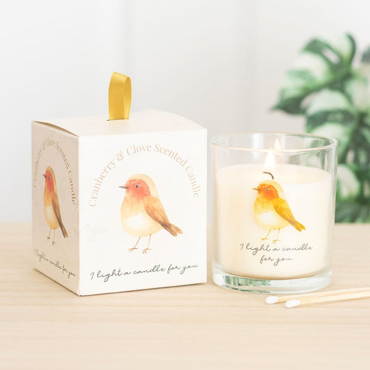 remembrance Candle with a decorative box featuring illustrations of robin on a light background