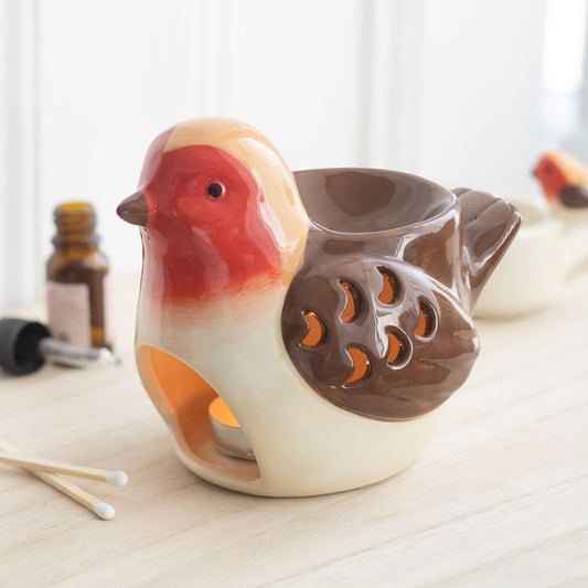 Robin shaped ceramic oil burner and wax warmer with a distinctive red breast