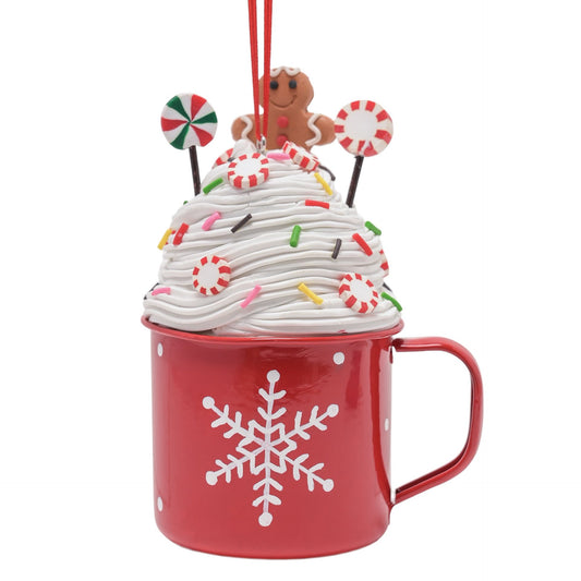 red mug with cream and gingerbread top tree decoration with lollipops and snowflake design