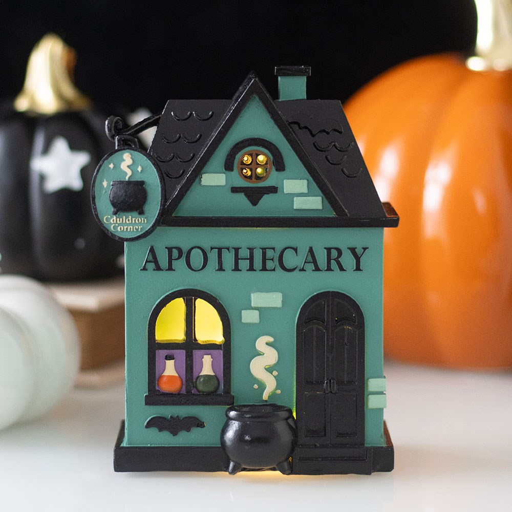Halloween-themed apothecary led house decoration with cauldrons