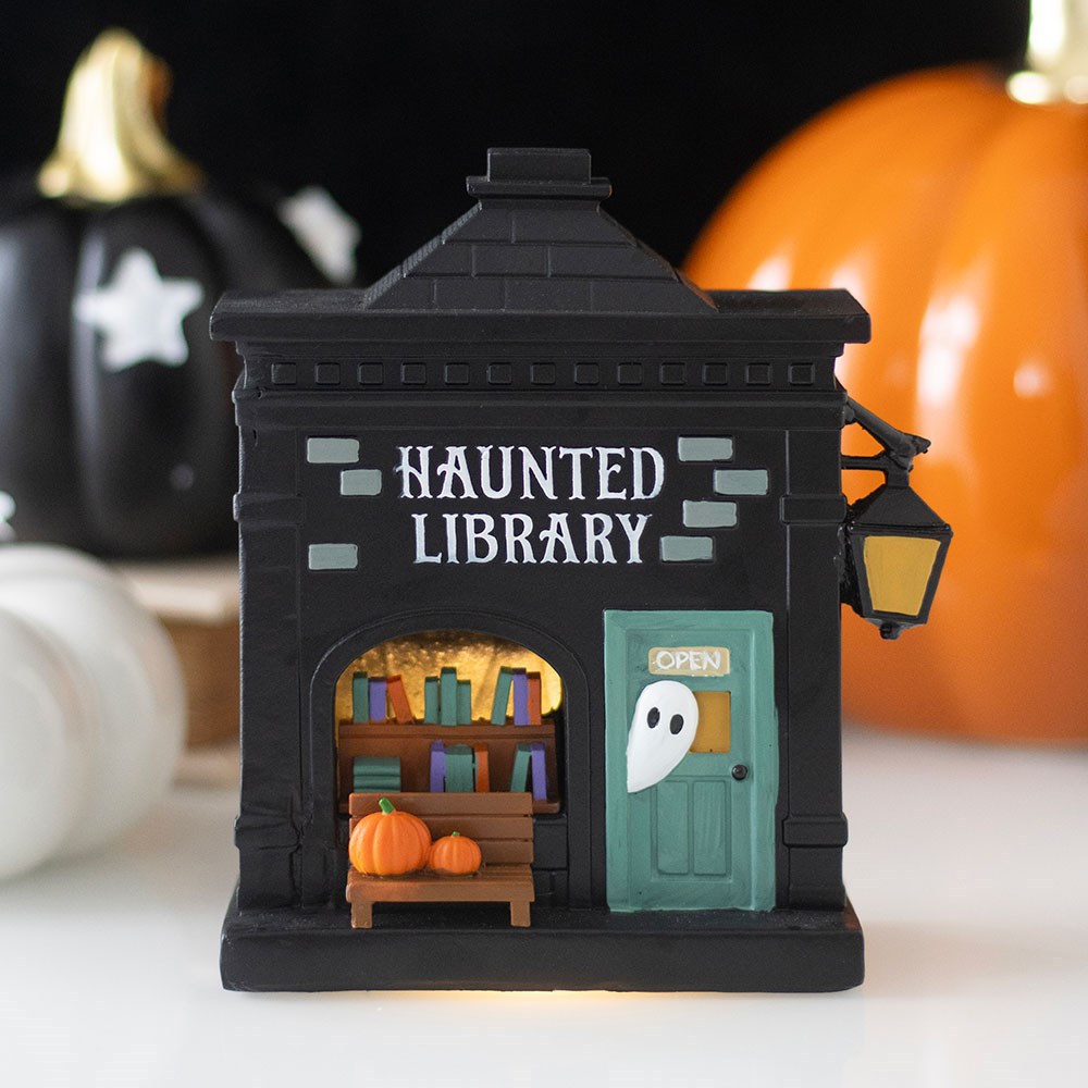 Haunted Library LED light up Halloween decoration creating a spooky glowing scene for seasonal home décor.