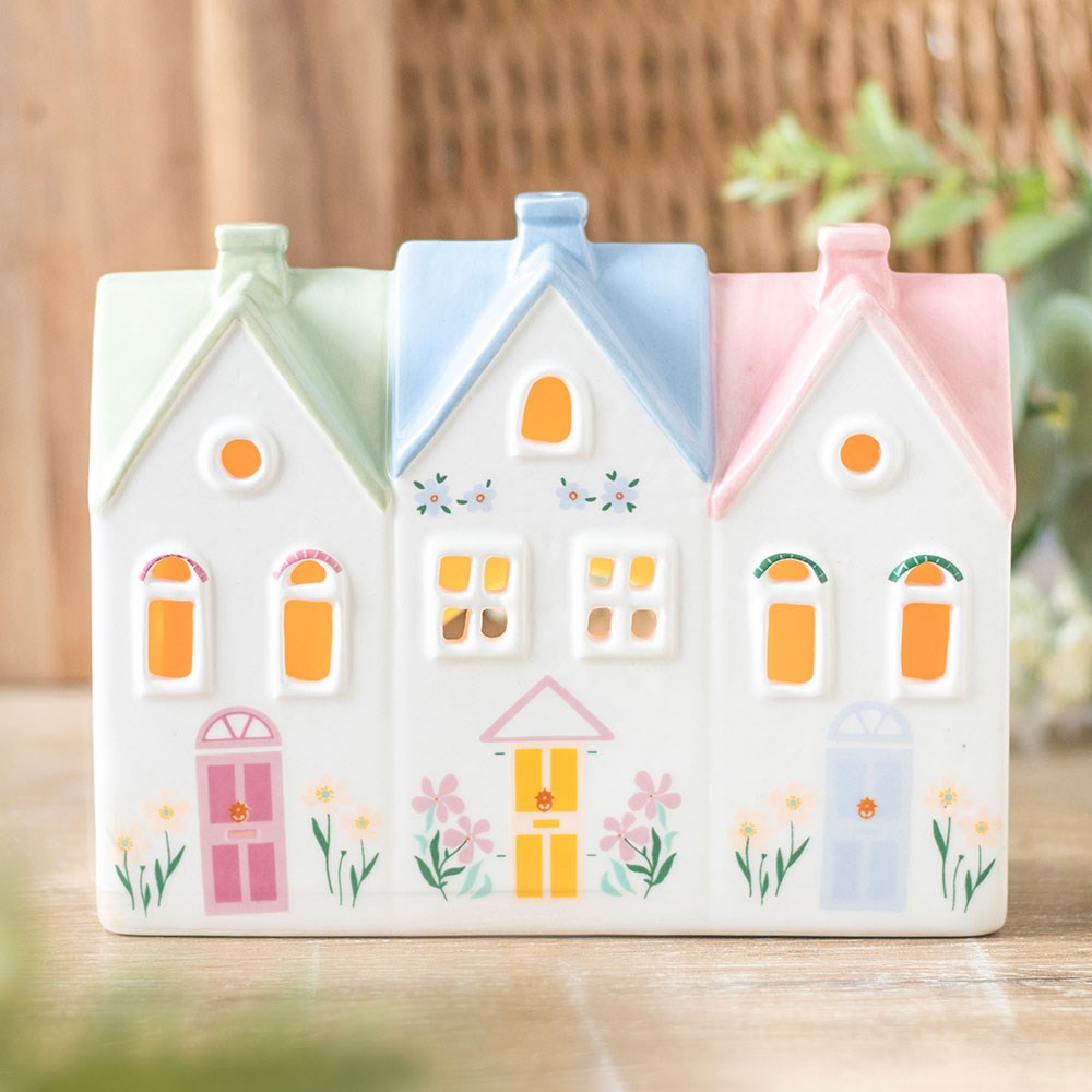 Decorative ceramic houses with pastel colours tea light holder and incense burner