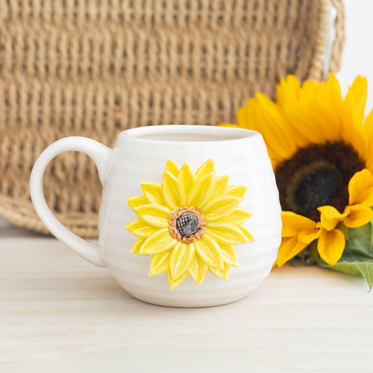 White mug with a yellow 3d sunflower design.