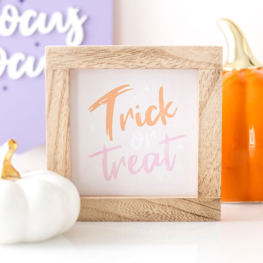Pink Trick or Treat wooden frame sign in pastel pink white and orange Halloween home decoration