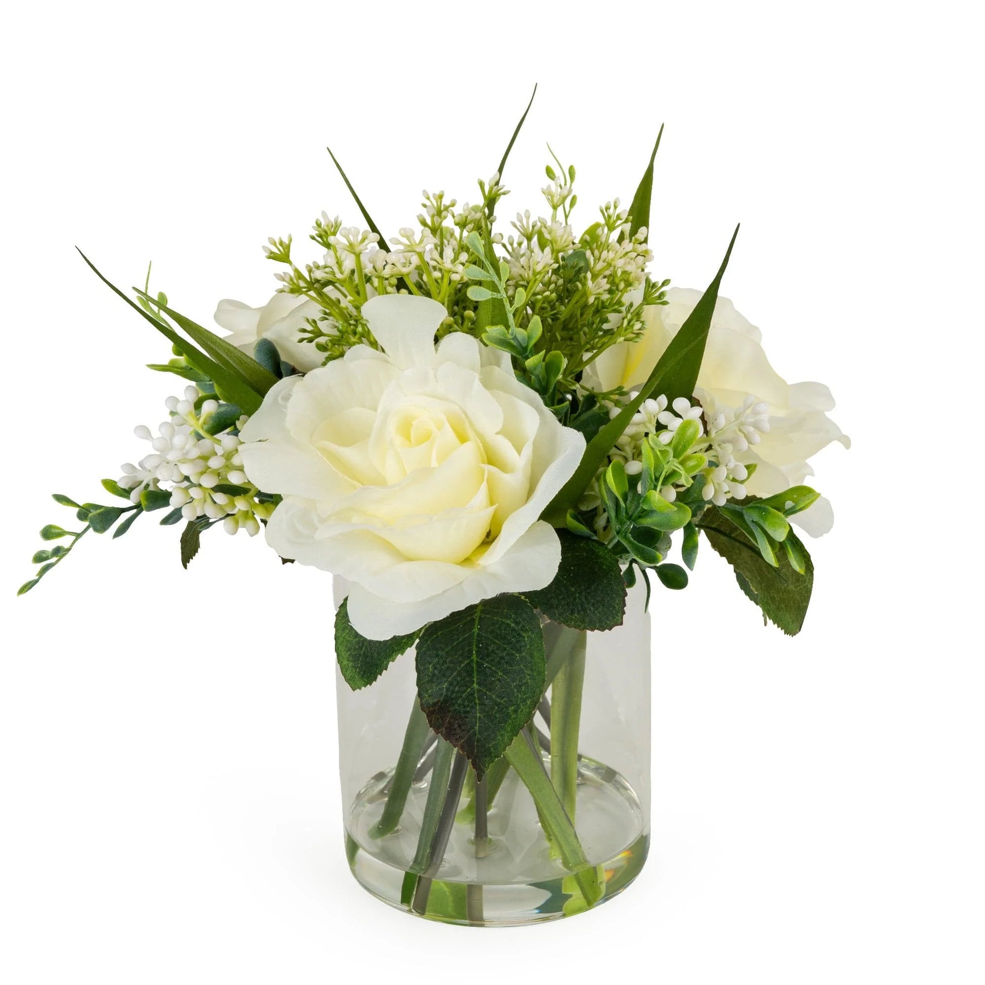 artificial roses in a glass pot by candlelight home