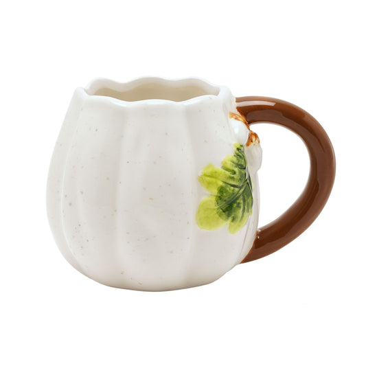 White ceramic pumpkin shaped mug with a brown handle and green leaf design on a white background
