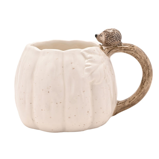 Pumpkin-shaped mug with a hedgehog sitting on a brown branch handle 