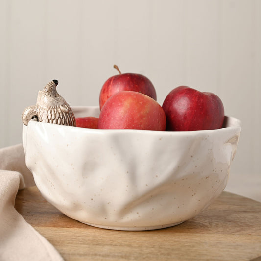 White ceramic serving  bowl with hedgehog perched on the side