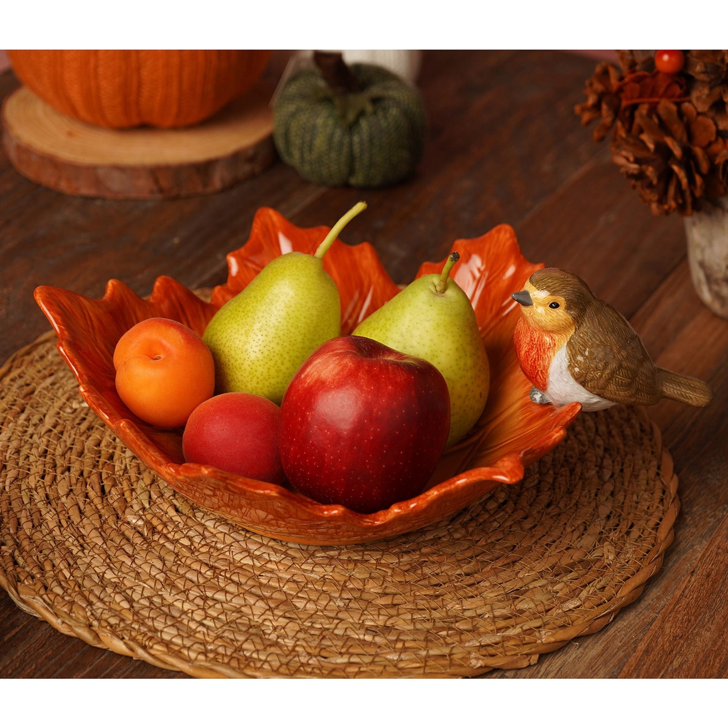 robin on a brown leaf ceramic bowl 