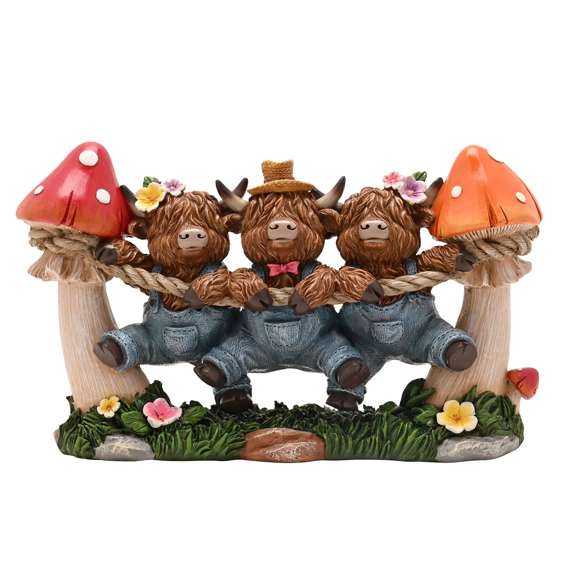 Three Highland cow figurines holding onto a top as they dangle with mushrooms and flowers 
