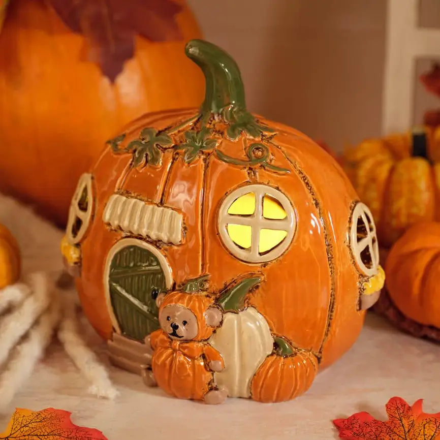 Harvest Home stoneware pumpkin house hand painted tea light holder, autumn ceramic candle lantern decoration for farmhouse Halloween and Thanksgiving home décor.
