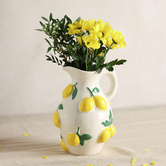 ceramic white jug vase with lemon and leaves design all over small handle and 25cm tall