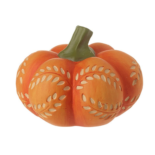 Decorative orange pumpkin with cut-out patterns and green stalk