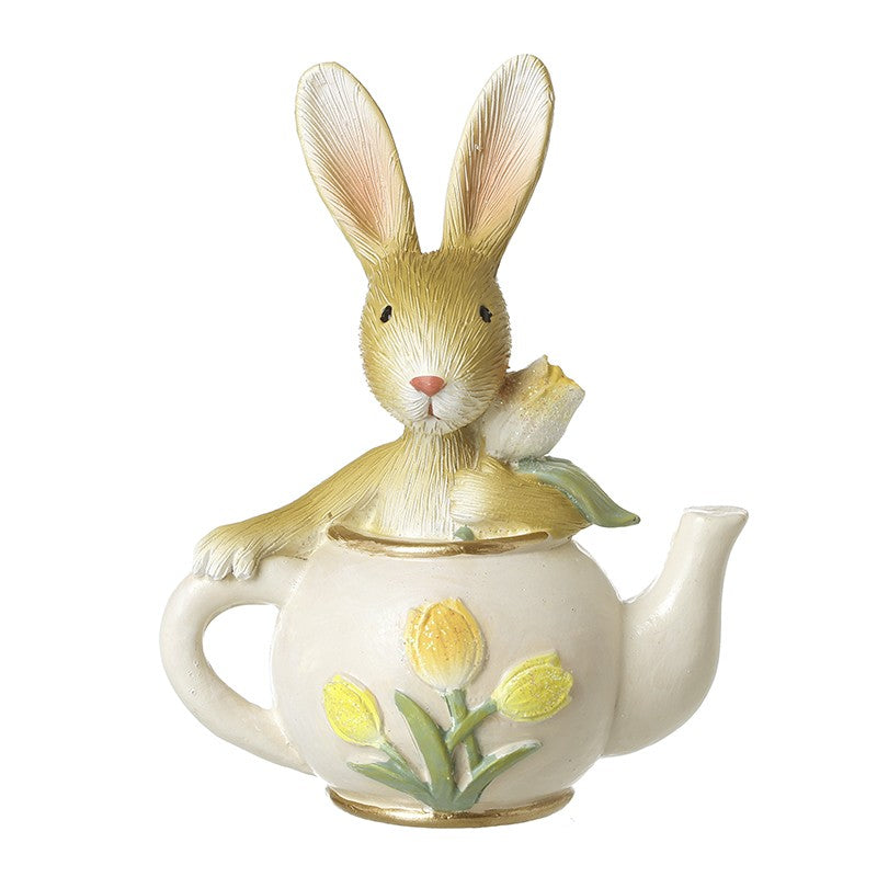 bunny resin sitting inside a teapot with tulips 