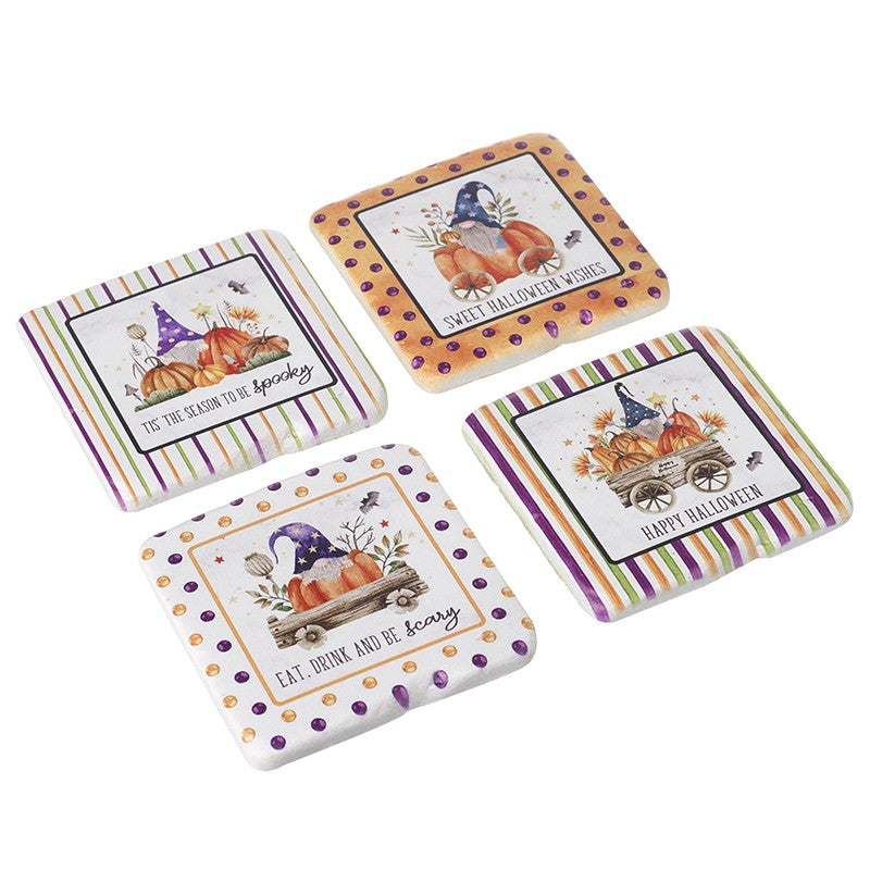 Set of four Halloween-themed coasters with pumpkins and gnomes on a white background.