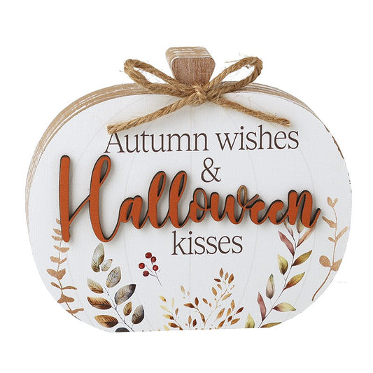 Decorative pumpkin-shaped sign with 'Autumn wishes & Halloween kisses' text and leaf designs 