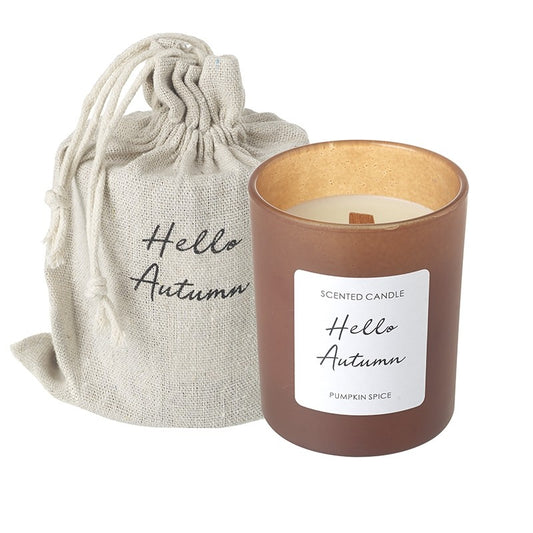 Scented candle labeled 'Hello Autumn' with a matching drawstring bag on a white background