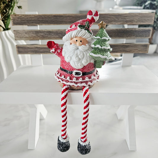 Decorative Santa Claus figure with candy cane legs 