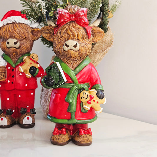 Mrs Christmas Highland cow figurine in red and green festive dressing gown