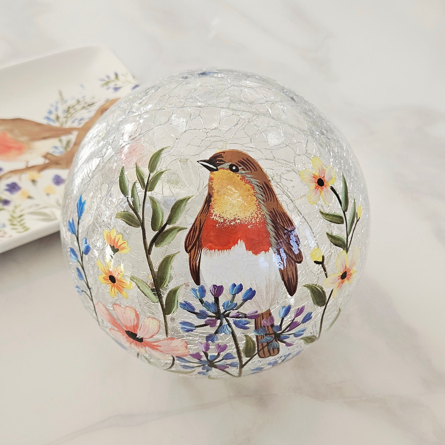 Decorative led  glass ball with a robin bird and floral design 