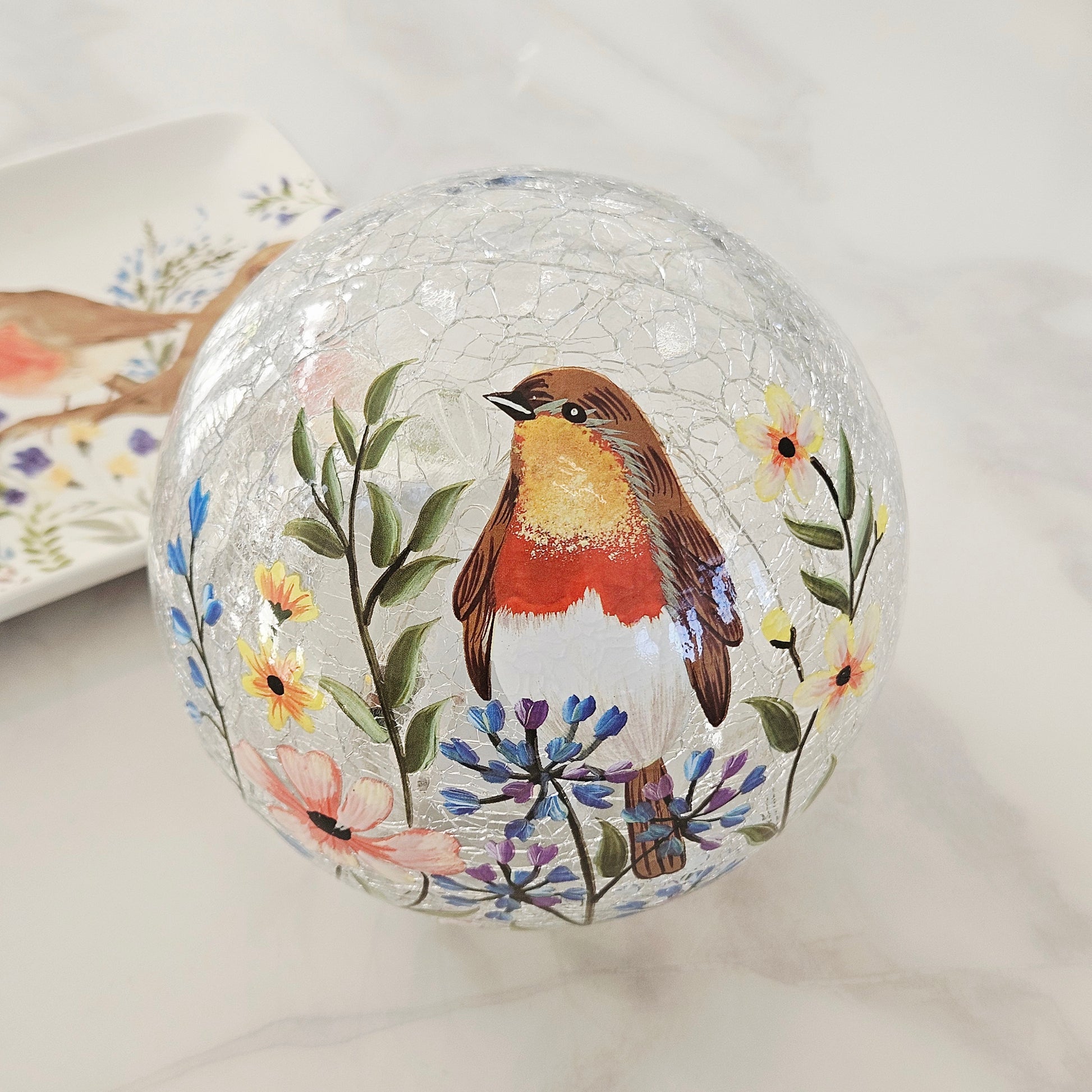 Decorative led  glass ball with a robin bird and floral design 