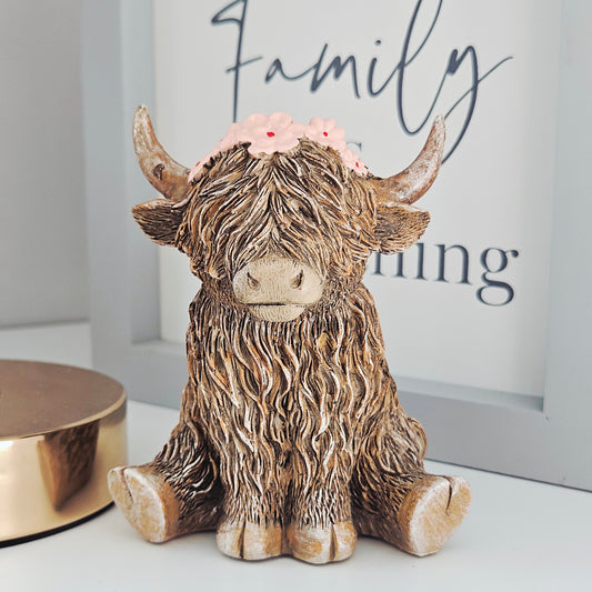 Highland cow ornament wearing a flower crown