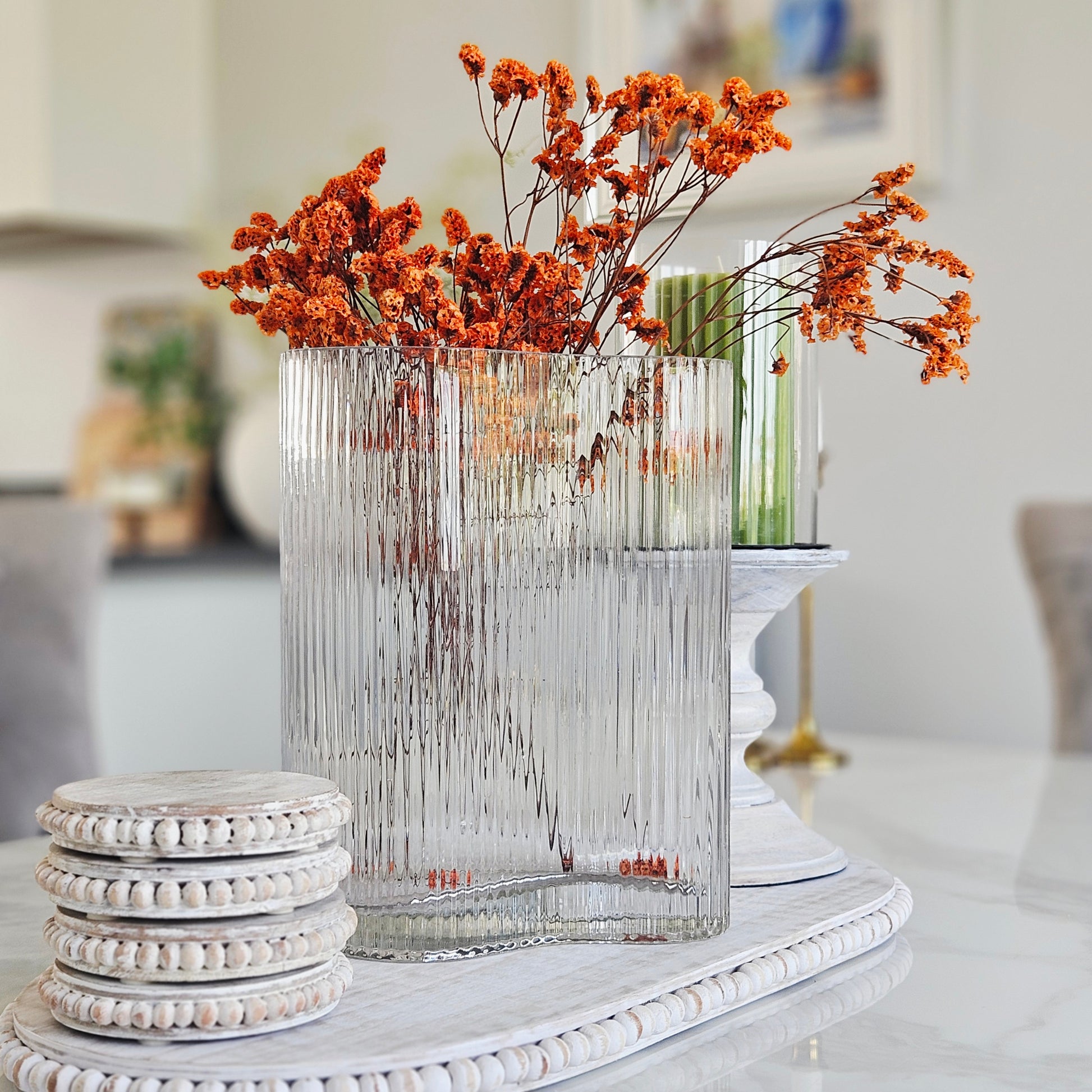 Clear ribbed glass vase with elegant curved design for fresh flowers.
Large decorative clear glass vase with ribbed textured finish.
