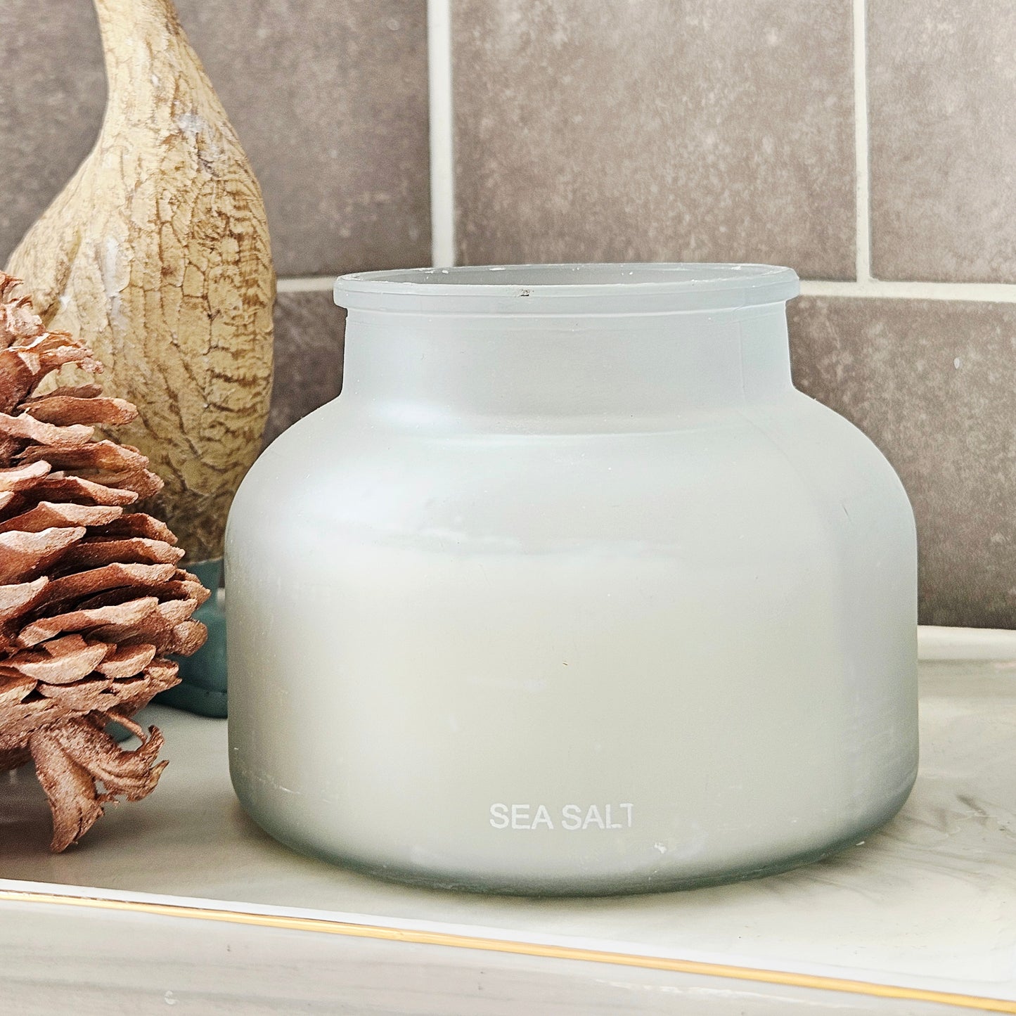 large glass candle labelled 'Sea Salt' 500g