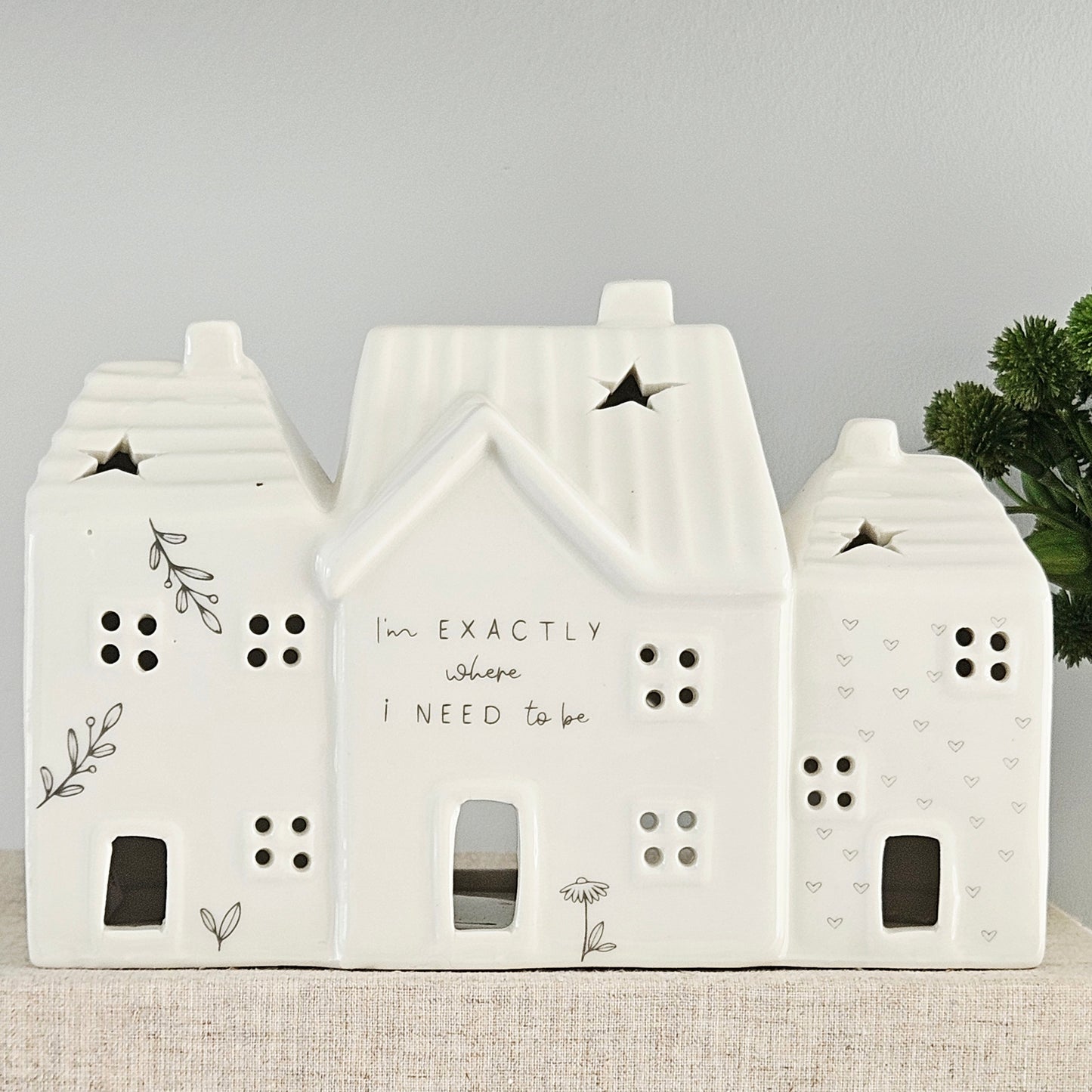 Decorative house-shaped ceramic tea light house with I'm exactly where I need to be wording and flower detail
